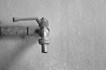 faucet on concrete  wall