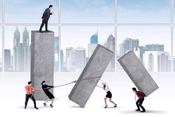 Manager orders his workers to work harder