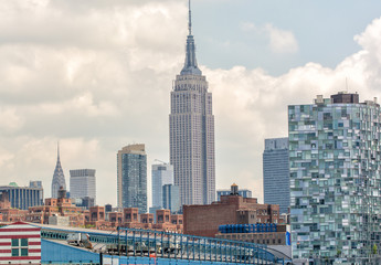 Amazing view of Manhattan skyline. City skyscrapers on a cloudy - obrazy, fototapety, plakaty