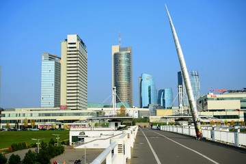 Fototapeta na wymiar Vilnius city skyscrapers view from walking bridge