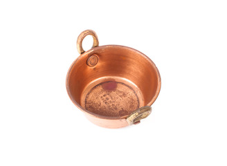 old copper pan with handles and with spots corrosion on white ba