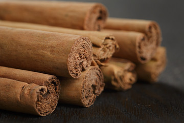 true cinnamon sticks on wooden table