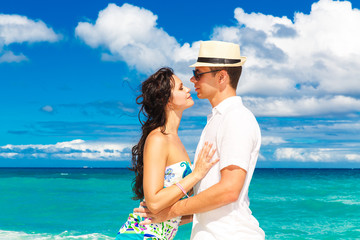 young loving couple having fun in the tropical beach