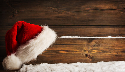 Obraz na płótnie Canvas Christmas Santa Claus Hat Hanging On Wood Plank, Xmas Concept, S