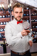 Sommelier in the wine cellar