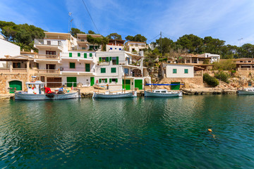 Fototapeta na wymiar Boats anchored in port of fishing village Cala Figuera, Majorca