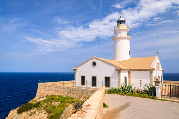 Fototapeta na wymiar Lighthouse on cliff and sea view, Cala Ratjada, Majorca island