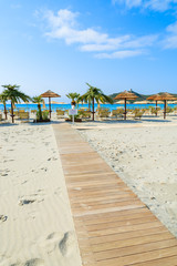 Wooden walkway to Porto Giunco beach, Sardinia island, Italy