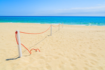 Sandy Cala Sinzias beach and turquoise sea water, Sardinia