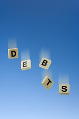 Debts tumble