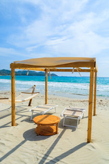 Sunchairs and hammocks on Porto Giunco beach, Sardinia island