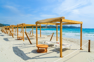 Sunchairs and hammocks on Porto Giunco beach, Sardinia island