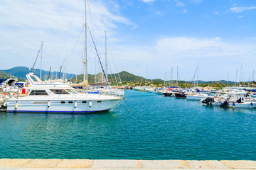 Obraz premium View of Porto Giunco port with sailboats and yachts, Sardinia