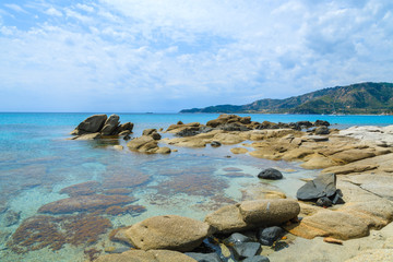 Rocks and sea water on Campolungo beach, Sardinia island, Italy