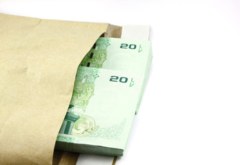 Bag with Thai money on white background