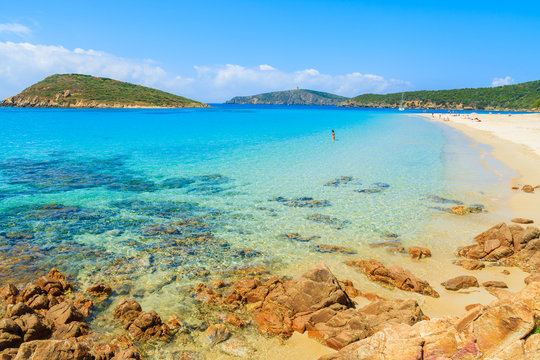 Sand and turquoise sea water of Teuleda beach, Sardinia island