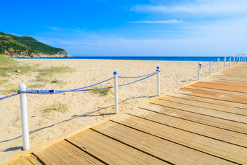 Wooden walkway to Capo Boi sandy beach, Sardinia island, Italy