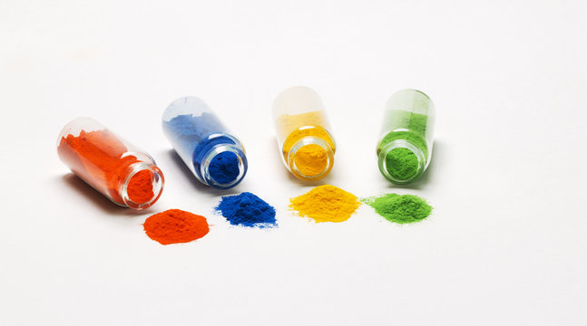 Glass bottles filed with colored powder