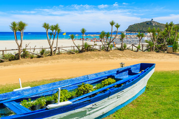 Blue fishing boat on Porto Giunco beach, Sardinia island