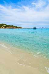 Obraz premium Fishing boat on turquoise sea water, Cala Pira, Sardinia island
