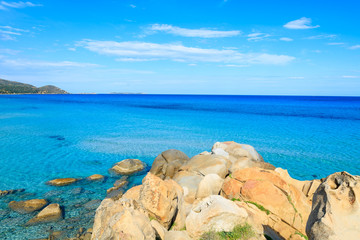 Rocks and azure sea water of Porto Giunco bay, Sardinia island
