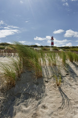 Fototapeta na wymiar Strand mit Leuchtturm am Ellenbogen auf Sylt