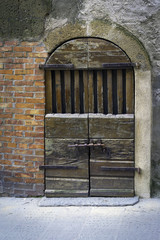 Old wooden door in Tuscany. Color image