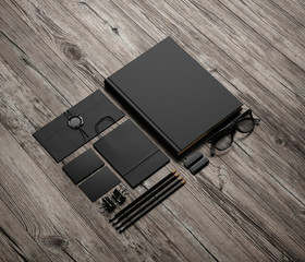 Set of black branding elements on wood background