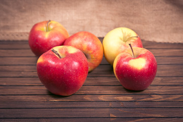 red apples on wooden table