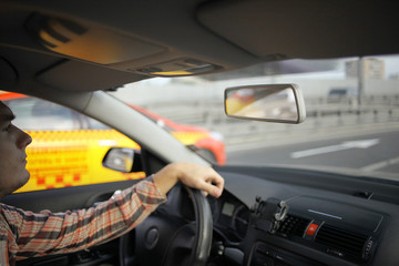 inside the car driver driving on the road