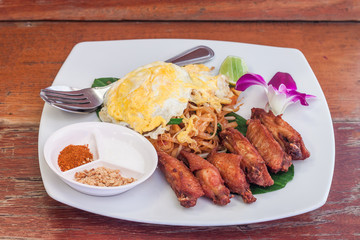 Pad thai with fried chicken wing and egg