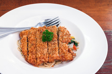 Spaghetti basil sauce with fried pork