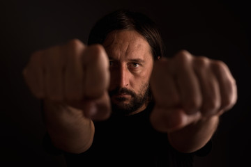 Adult male with clenched fists