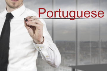 businessman writing in the air portuguese