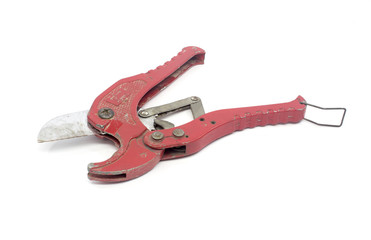 red old scissors for cutting plastic pipe
