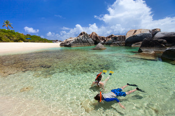 Fototapeta na wymiar Family snorkeling at tropical water
