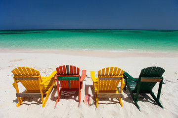 Colorful chairs on Caribbean beach
