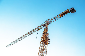 Industrial crane against blue sky