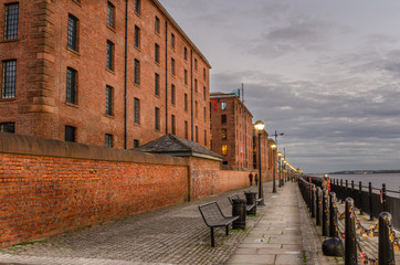 Cobbled Footpath Lined with Renovated Buildings at Twilight
