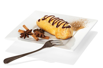 Chocolate eclairs with cream filling on a platter