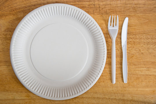 Empty Paper Plate On Wooden Background