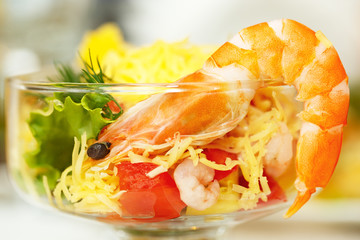 Boiled shrimp salad with cheese and vegetables.