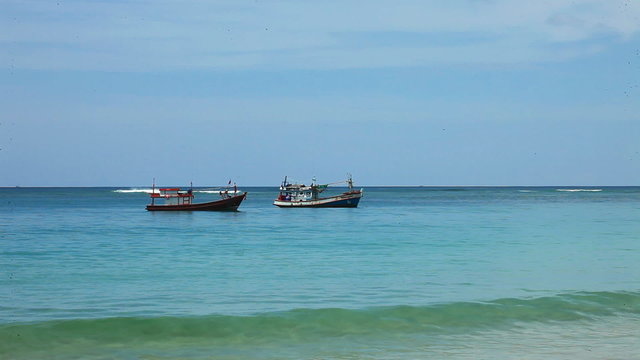 Boats in the tropical sea near tropical beach. Thailand