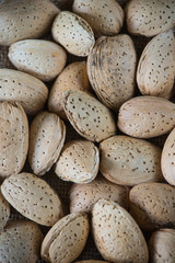 Whole almonds on wooden table