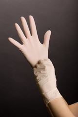 Putting on latex gloves