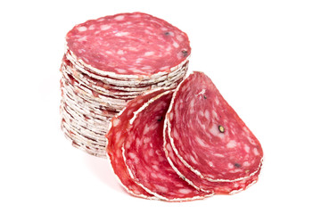Slices of salami sausage on a white background
