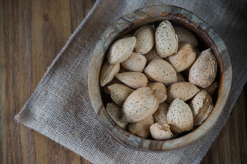 Table top view on almonds in bowl