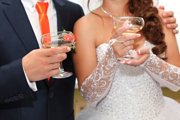 wine glasses in hand bride and groom