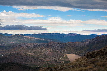 mountain peak with greenery on the sky background
