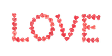 The text love with red candy hearts.